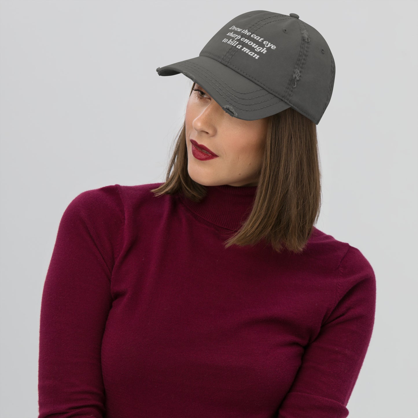 Draw the Cat Eye Sharp Enough to K*ll a Man Distressed Dad Hat